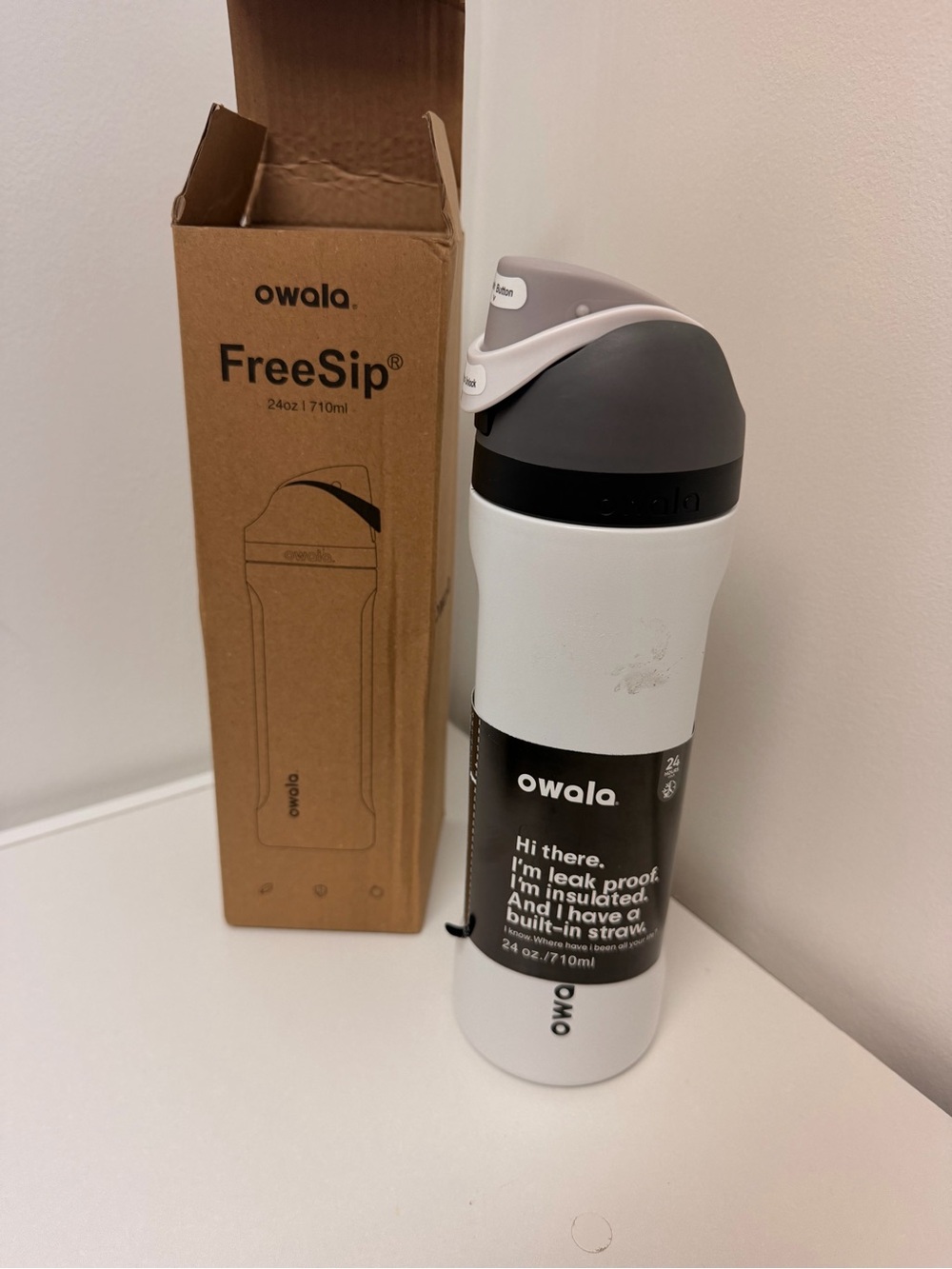 Owala FreeSip Insulated Water Bottle in White with Gray Lid